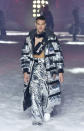 <p>Model wears a futuristic silver foil puffer coat, trousers, and fanny pack across his chest at the Philipp Plein FW18 show. (Photo: Getty) </p>