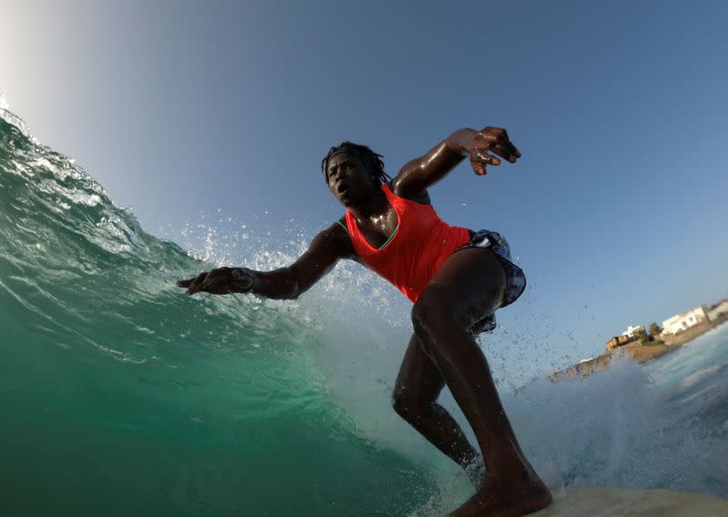 Wider Image: Meet Senegal's first female pro surfer inspiring girls to take to the waves