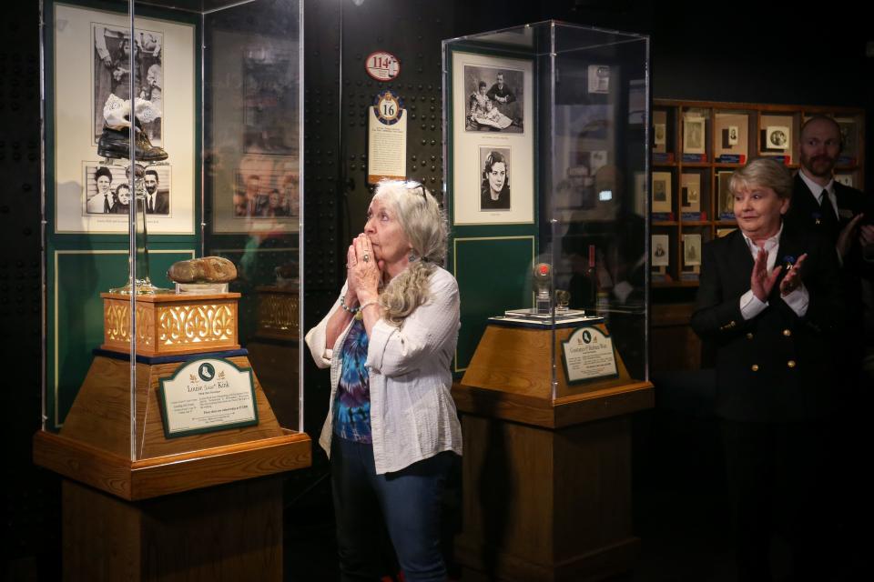 Joan Randall, left, reacts to seeing the temporary display of her mother's shoes for the first time at the Titanic Museum Attraction in Branson on Tuesday, June 6, 2023. Randall is one of only a handful of direct descendants of Titanic survivors. Her mother, Louise "Luise" Kink, was one of 135 children aboard the ship the evening it sank on April 15, 1912.