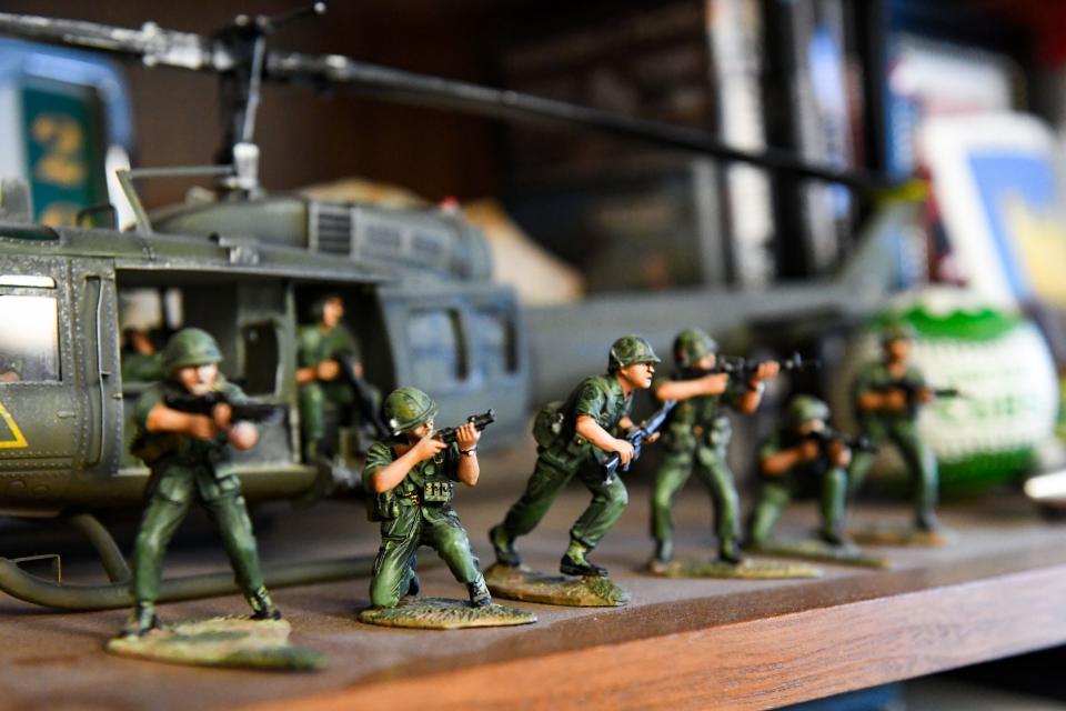 Military figurines stand in line on a shelf in Gene Murphy's office on Wednesday, November 10, 2021, at the Disabled American Veterans office in Sioux Falls.