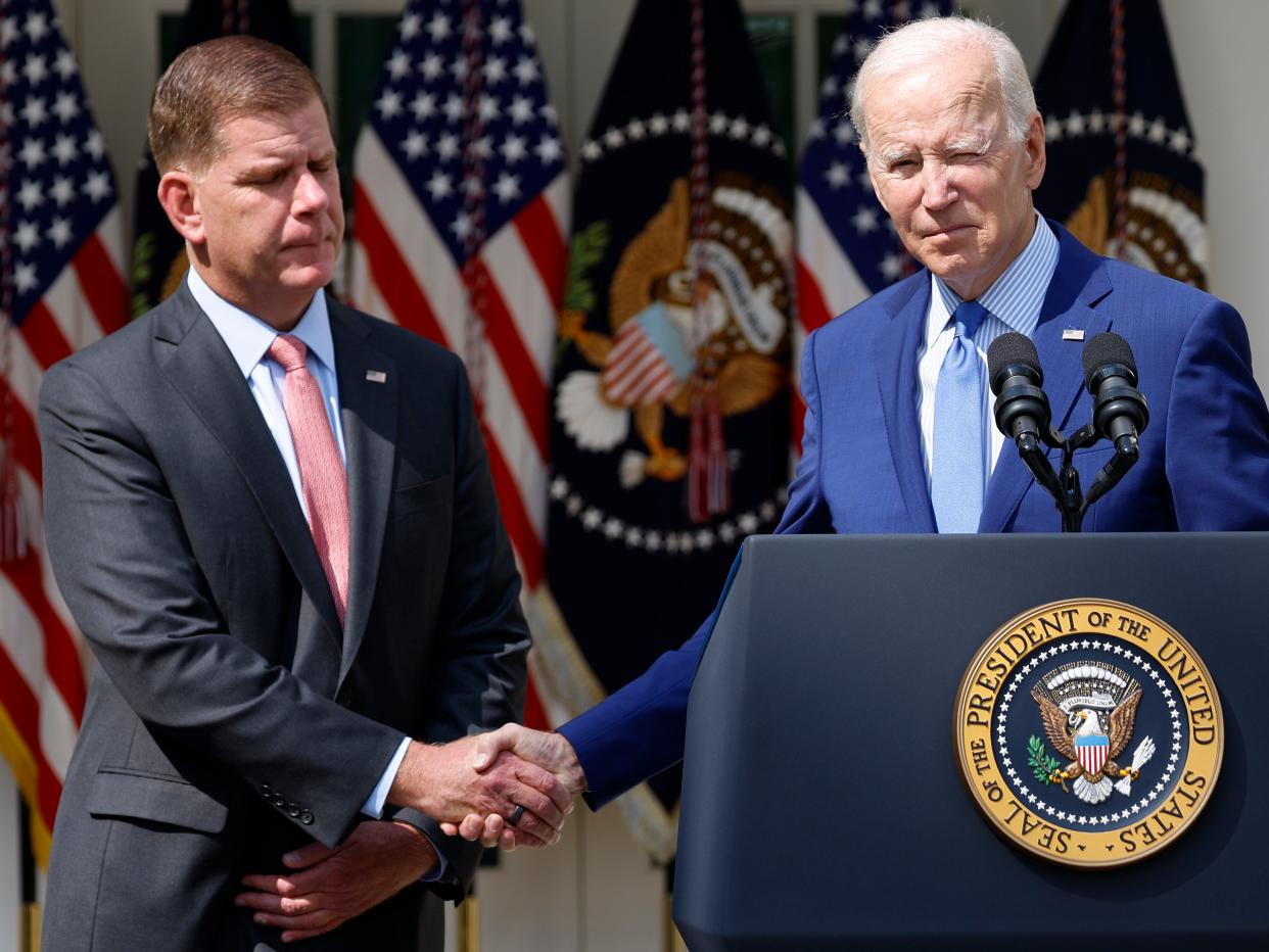 Marty Walsh (left) shakes hands with President Biden (right)