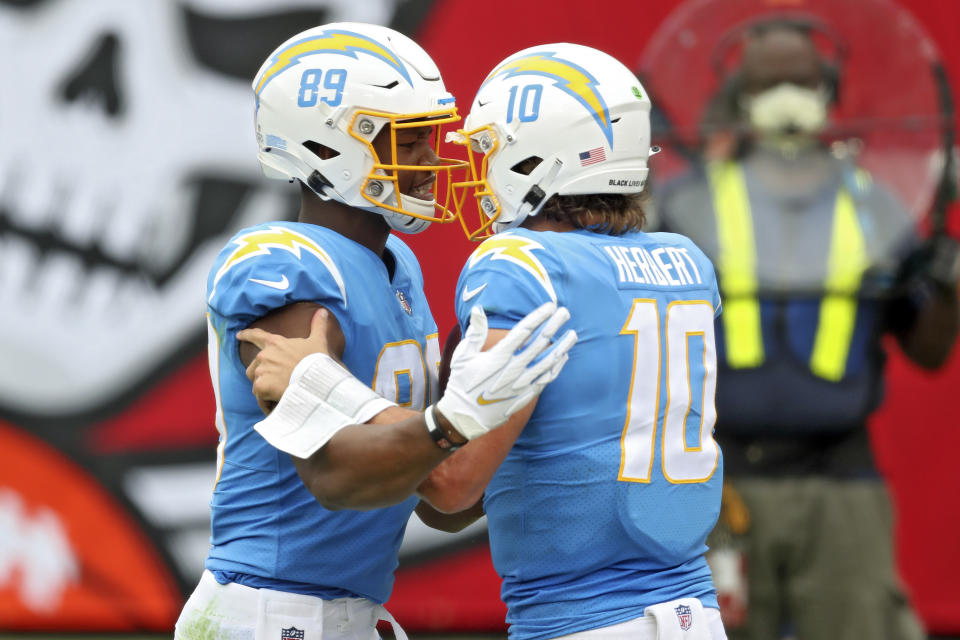 Los Angeles Chargers tight end Donald Parham Jr., (89) celebrates with quarterback Justin Herbert (10) after Parham Jr., caught a 19-yard touchdown pass during the first half of an NFL football game against the Tampa Bay Buccaneers Sunday, Oct. 4, 2020, in Tampa, Fla. (AP Photo/Mark LoMoglio)