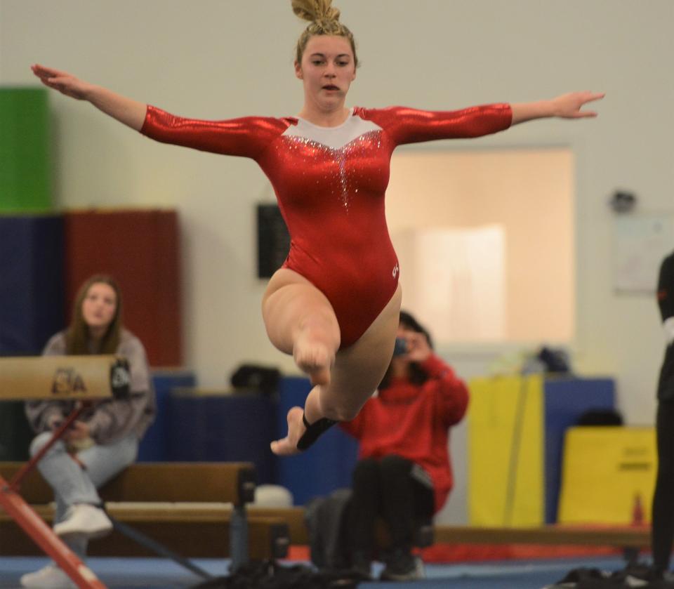 NFA senior co-captain Patrice Carrignan performs on the floor exercise at Thames Valley Academy in Franklin.