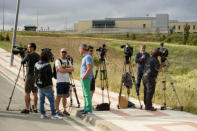 Journalists wait outside the prison where three of the five men cleared of gang rape of a teenager and convicted of a lesser crime of sexual abuse are due to leave jail after being granted provisional release in Pamplona, Spain, June 22, 2018. REUTERS/Pablo Lasaosa