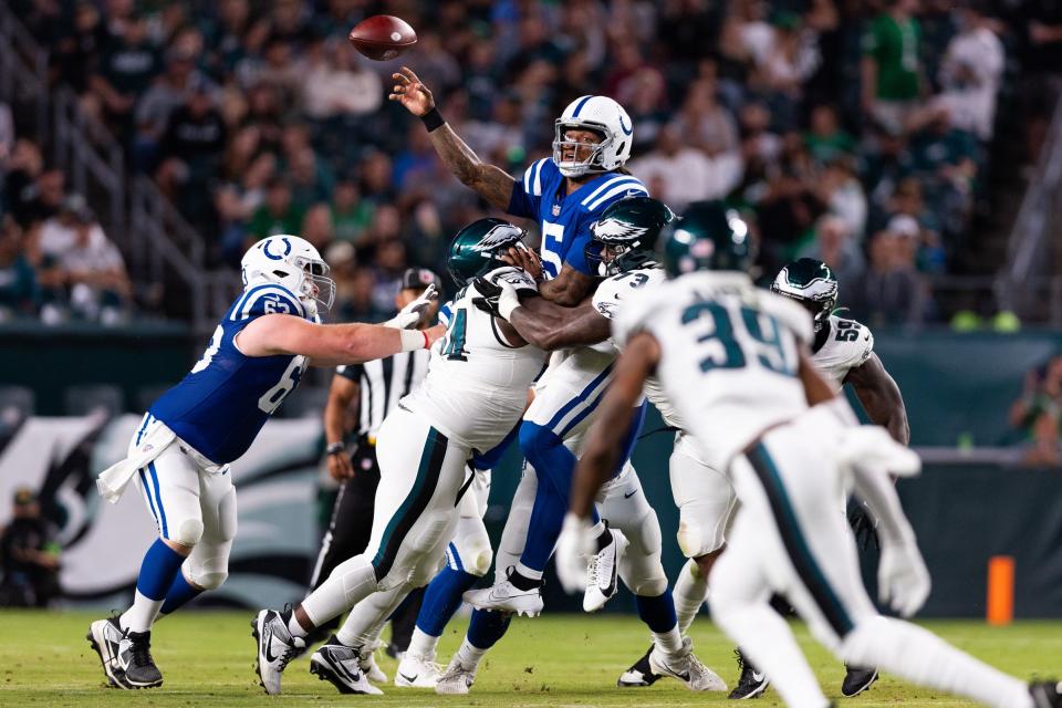 Aug 24, 2023; Philadelphia, Pennsylvania, USA; Indianapolis Colts quarterback Anthony Richardson (5) passes the ball while being hit by Philadelphia Eagles defensive tackle Marvin Wilson (73) and defensive tackle Robert Cooper (64) during the second quarter at Lincoln Financial Field. Mandatory Credit: Bill Streicher-USA TODAY Sports