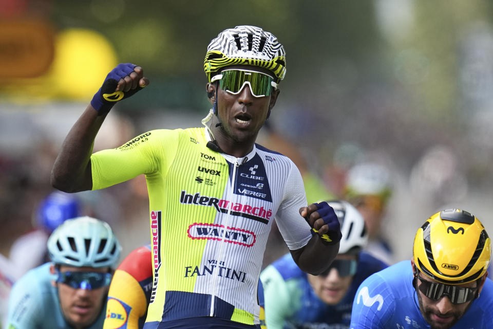 Eritrea's Biniam Girmay celebrates winning ahead of Colombia's Fernado Gavira, right, during the third stage of the Tour de France cycling race over 230.8 kilometers (143.4 miles) with start in Piacenza and finish in Turin, Italy, Monday, July 1, 2024. (AP Photo/Daniel Cole)