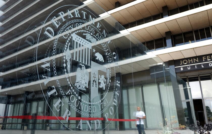 This Wednesday, March 18, 2015 photo shows the front of the headquarters of the Los Angeles Department of Water and Power in downtown Los Angeles. The Los Angeles Department of Water and Power lost up to $88 million in commercial billings because of the botched rollout of a computer billing system. (AP Photo/Richard Vogel)