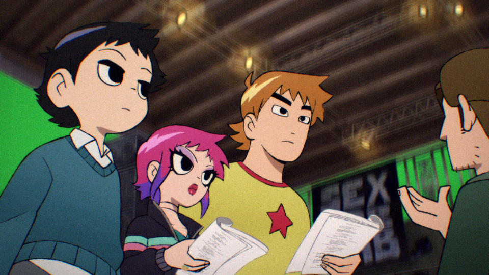 Scott Pilgrim Takes Off (L to R) Kieran Culkin as Wallace Wells, Brie Larson as Envy Adams, Brandon Routh as Todd Ingram and Kevin McDonald as The Director in Scott Pilgrim Takes Off. Cr. COURTESY OF NETFLIX © 2023