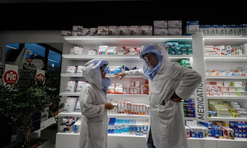 Pharmacists in a chemist in Rome.