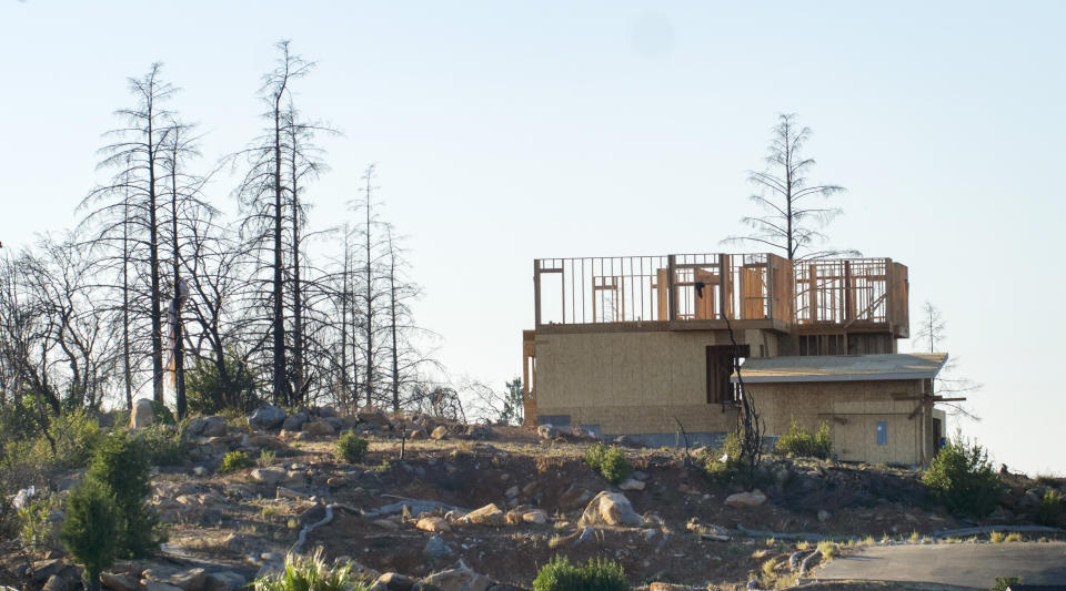 In this Tuesday, Nov. 5, 2019, photo, a new home construction project sits on a hilltop in Santa Rosa, Calif. Many homes in the city were destroyed during the Tubbs Fire of 2017, and many of those homes are still being replaced and rebuilt. This Fountaingrove section of Santa Rosa in California's wine country was one of the neighborhoods turned to piles of ash and debris by the now infamous Tubbs Fire of 2017. It had been the most destructive wildfire in California history, until last year, when the Camp Fire ravaged the town of Paradise, to the north, killing 86 people. (AP Photo/Lacy Atkins)