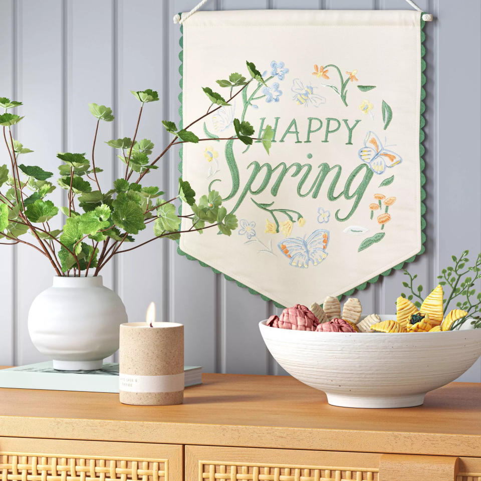 Banner with "Happy Spring" text, butterflies, and flowers decoration