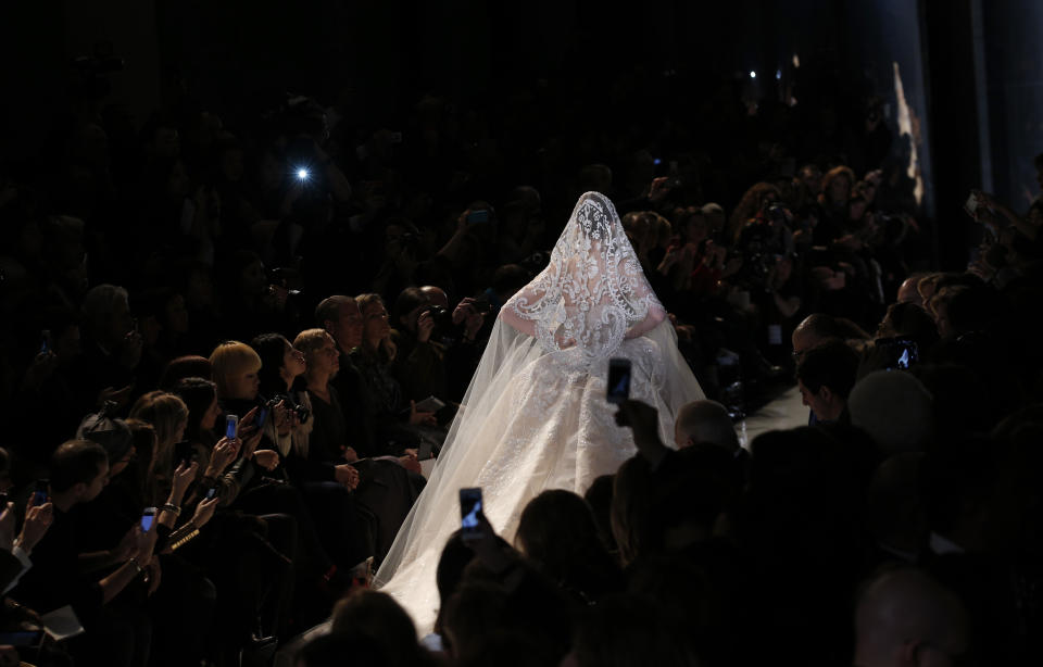 A model wears the wedding gown by Lebanese fashion designer Elie Saab for his Spring Summer 2013 Haute Couture fashion collection, presented in Paris, Wednesday, Jan.23, 2013. (AP Photo/Christophe Ena)