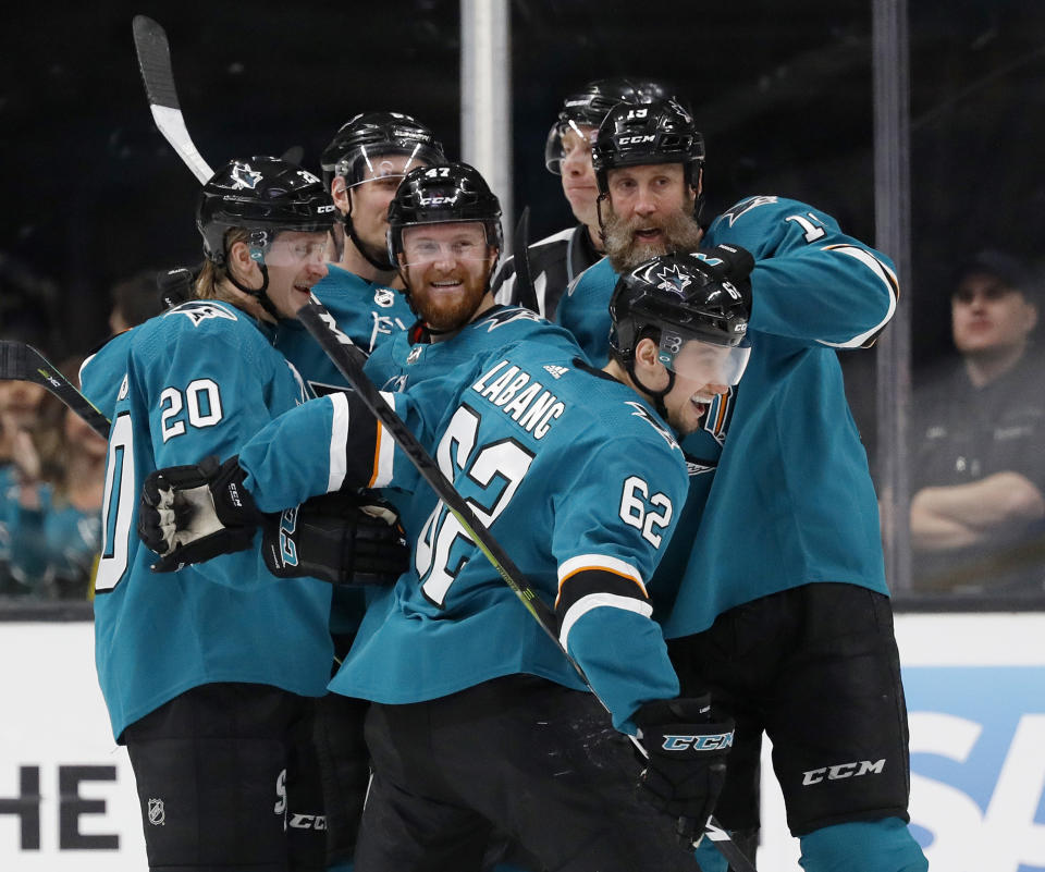 San Jose Sharks' Marcus Sorensen (20), Joakim Ryan (47), Joe Thornton (19), celebrate with Kevin Labanc (62), center, who scored goal against the Colorado Avalanche in the second period of Game 1 of an NHL hockey second-round playoff series at the SAP Center in San Jose, Calif., on Friday, April 26, 2019. (AP Photo/Josie Lepe)