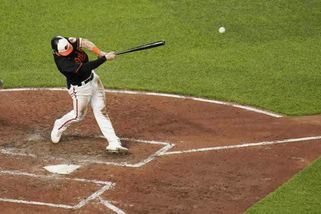 A crowd watches the fifth inning of a baseball game between the