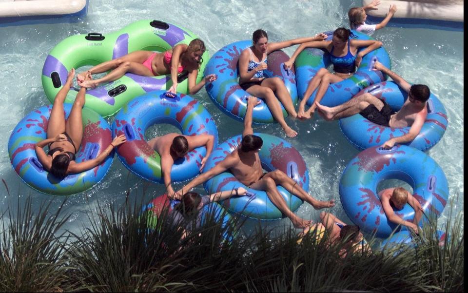 Youngsters tubing down the Lazy River at the Rapids Water Park. The Lazy River circles the park and is one of the most popular of the parks  attractions.