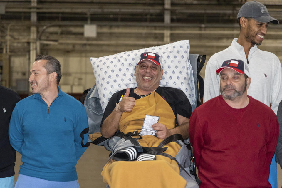 From left, freed Americans Eyvin Hernandez, Edgar Jose Marval Moreno, Jason Saad, in red, and Savoi Wright, who were released in a prisoner swap deal between U.S. and Venezuela, pose for a photo at Kelly Airfield Annex, Wednesday, Dec. 20, 2023, in San Antonio, Texas. (AP Photo/Stephen Spillman)