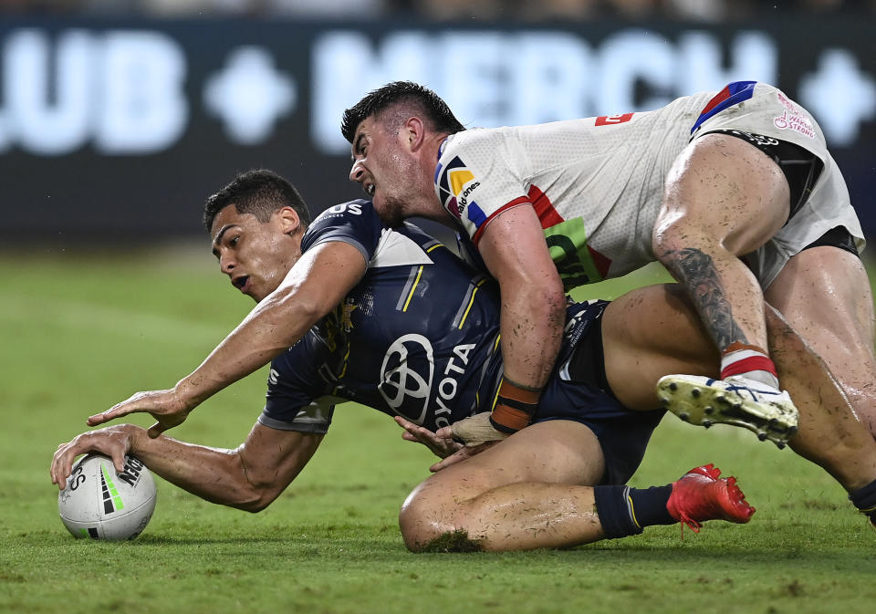TOWNSVILLE, AUSTRALIA - MAY 07:  Heilum Luki of the Cowboys scores a try during the round nine NRL match between the North Queensland Cowboys and the Newcastle Knights at Qld Country Bank Stadium, on May 07, 2022, in Townsville, Australia. (Photo by Ian Hitchcock/Getty Images)