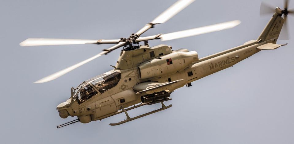 Joint terminal attack controllers relay air support missions during a 2023 exercise that included a US Marine Corps Bell AH-1Z Viper attack helicopter.