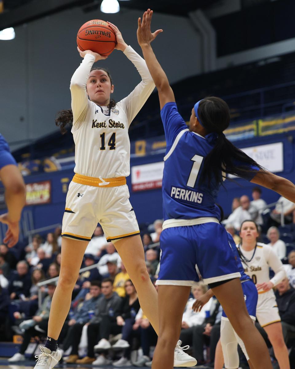 Kent State guard Katie Shumate pulls back for a jump shot while Buffalo guard Latrice Perkins goes up to block during an NCAA basketball game Wednesday, Jan. 4, 2022 in Kent, OH.