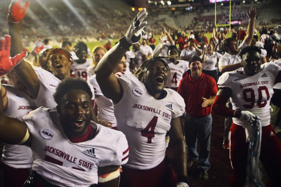 Jacksonville State players celebrate after a 20-17 win in an NCAA college football game against Florida State on Saturday, Sept. 11, 2021, in Tallahassee, Fla. (AP Photo/Phil Sears)