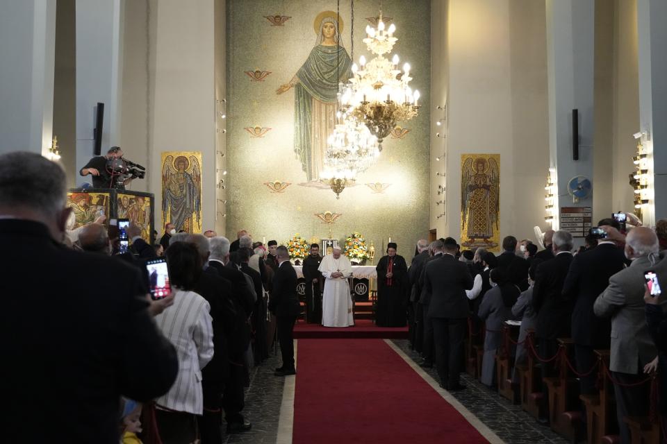 Pope Francis attends a ceremony at the Maronite Cathedral of Our Lady of Graces in Nicosia, Cyprus, Thursday, Dec. 2, 2021. Pope Francis' trip to Cyprus and Greece is drawing new attention to the plight of migrants on Europe's borders and the disconnect between Francis' Gospel-driven call for countries to welcome and integrate them and front-line governments that are increasingly unwilling or unable to let them in. (AP Photo/Alessandra Tarantino)