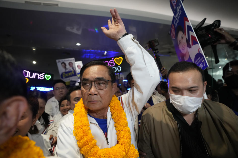 Thailand Prime Minister Prayuth Chan-ocha, center, leaves after a general election campaign in Nonthaburi province, Thailand, March 25, 2023. Voters disaffected by nine years of plodding rule by a coup-making army general are expected to deliver a strong mandate for change in Thailand's general election Sunday, May 14, 2023. (AP Photo/Sakchai Lalit)