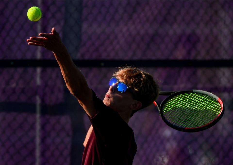 Bloomington North’s Connor O’Guinn serves during his No. 1 singles match against Bloomington South’s David Ciucu during the IHSAA Boys’ tennis sectional championship at South on Saturday, Sept. 30, 2023.