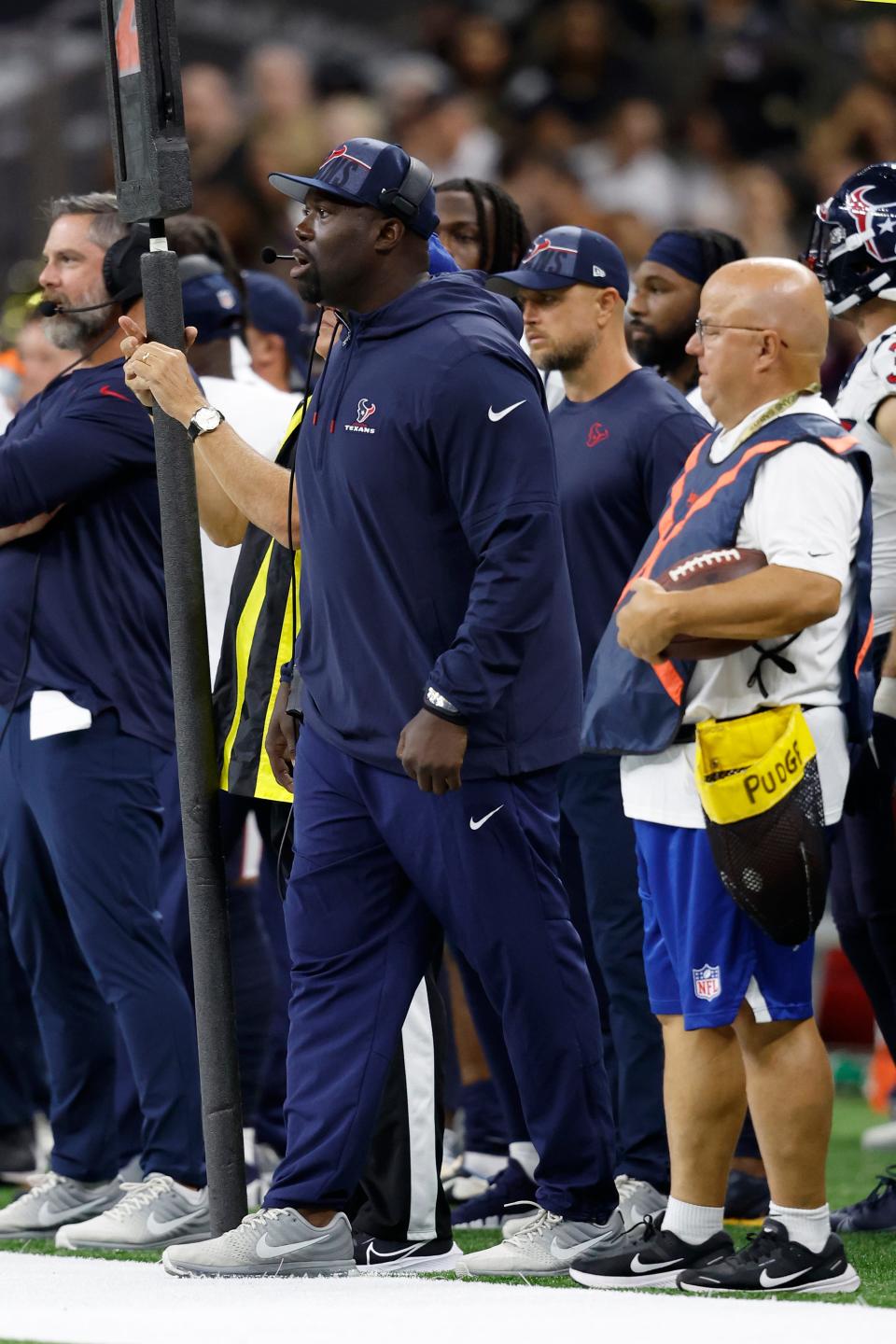 Houston Texans defensive line coach Jacques Cesaire looks onto the field during a preseason game earlier this season.