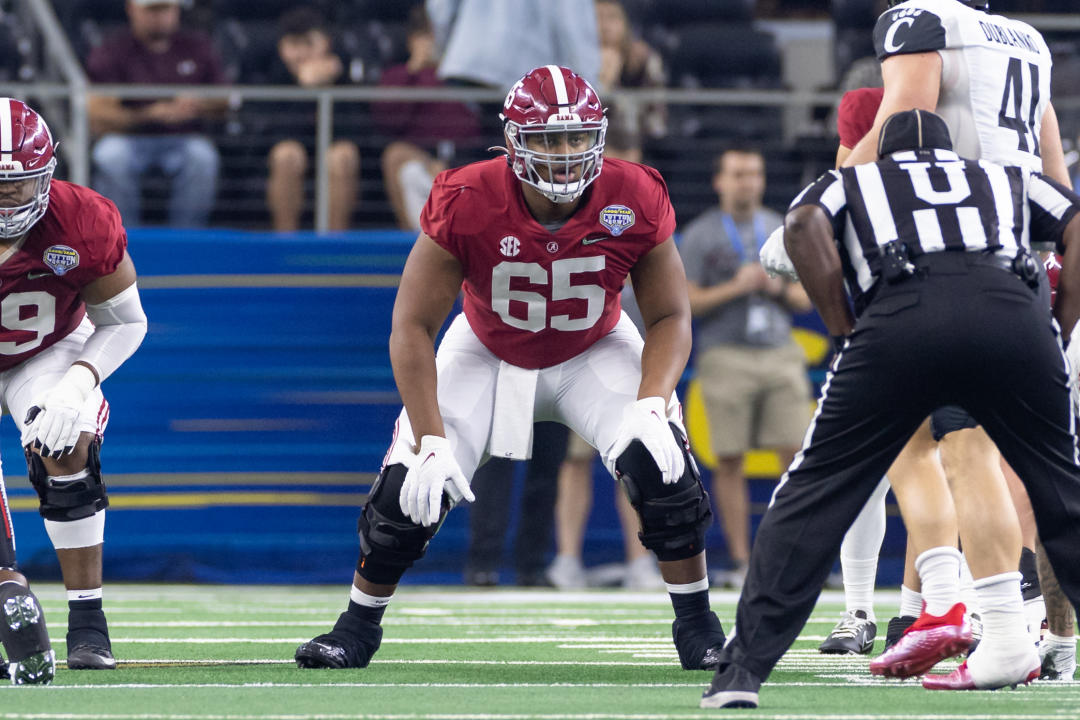 ARLINGTON, TX - DECEMBER 31: Alabama Crimson Tide offensive guard JC Latham (#65) blocks during the Goodyear Cotton Bowl CFP Semifinal college football game between the Alabama Crimson Tide and the Cincinnati Bearcats on December 31, 2021 at AT&T Stadium in Arlington, Texas. (Photo by Matthew Visinsky/Icon Sportswire via Getty Images)