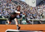 Andy Murray of Britain returns the ball to David Ferrer of Spain during their men's quarter-final match during the French Open tennis tournament at the Roland Garros stadium in Paris, France, June 3, 2015. REUTERS/Pascal Rossignol