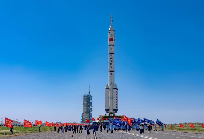 The combination of the Shenzhou-14 crewed spaceship and a Long March-2F carrier rocket is seen being transferred to the launching area of Jiuquan Satellite Launch Center on May 29, 2022 in Jiuquan, Gansu Province of China.