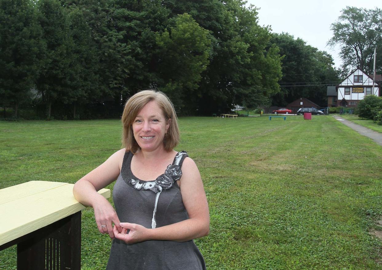 Bridget Ambrisco with the Akron Parks Collaborative stands in Boss Park that is one of two winners of the 2022 Akron Parks Challenge co-sponsored by the city of Akron and the Akron Parks Collaborative. Improved walkways, beautification with plants and flowers and seating will be added to the park.