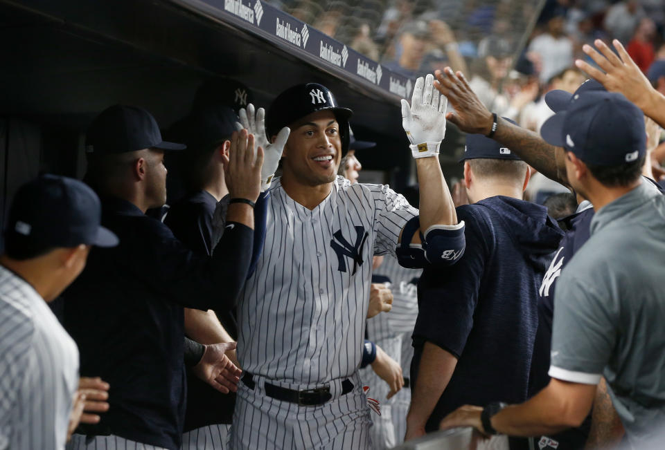 The fan who caught New York Yankees slugger Giancarlo Stanton’s 300th home run on Thursday night traded it in for free beer, among other things. (Getty Images)