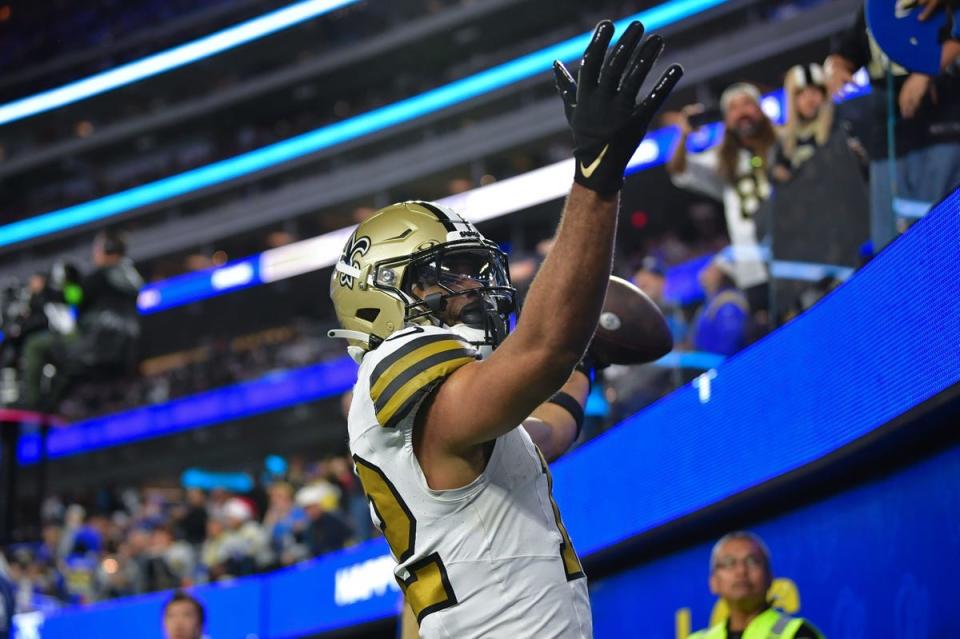 Dec 21, 2023; Inglewood, California, USA; New Orleans Saints wide receiver Chris Olave (12) celebrates after scoring on two point conversion against the Los Angeles Rams during the second half at SoFi Stadium. Mandatory Credit: Gary A. Vasquez-USA TODAY Sports