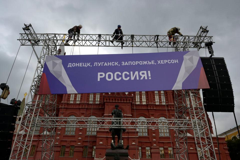 Banner reading “Donetsk, Lugansk, Zaporizhzhia, Kherson - Russia!” seen on top of a construction installed in front of the State Historical Museum outside Red Square in Moscow (AFP via Getty Images)