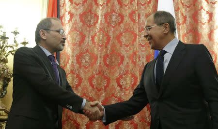 Russian Foreign Minister Sergei Lavrov and his Jordanian counterpart Ayman Safadi shake hands during their meeting in Moscow, Russia January 24, 2017. REUTERS/Maxim Shemetov