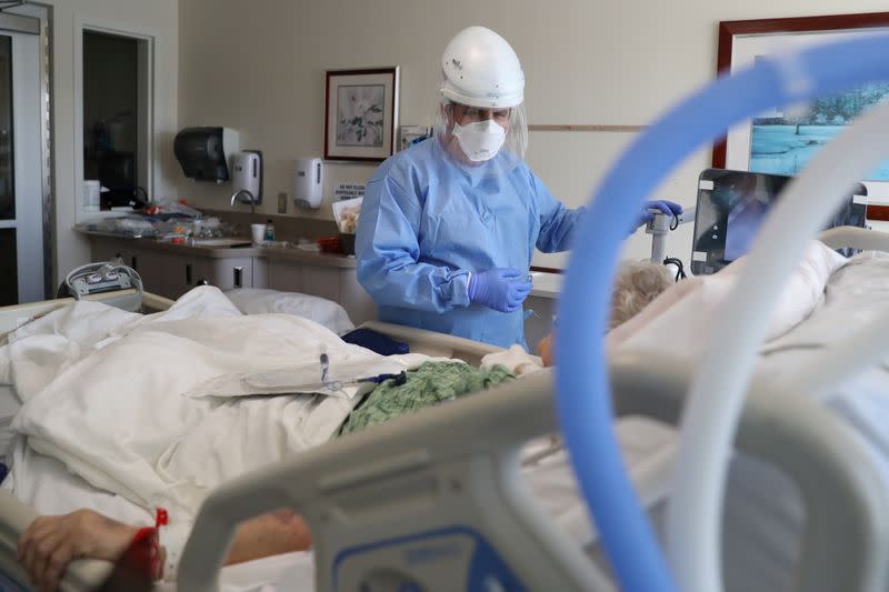 Dr. Dan Ponticiello, 43, prepares to intubate a coronavirus disease (COVID-19) patient in the COVID-19 ICU at Providence Mission Hospital in Mission Viejo