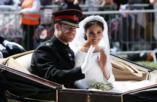<div class="inline-image__caption"><p>Prince Harry, Duke of Sussex and Meghan, Duchess of Sussex wave from the Ascot Landau Carriage during their carriage procession on Castle Hill outside Windsor Castle in Windsor, on May 19, 2018 after their wedding ceremony.</p></div> <div class="inline-image__credit">Aaron Chown - WPA Pool/Getty Images</div>