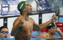 South Africa's Chad le Clos celebrates gold in the men's 100m butterfly final at the Aquatics World Championships in Kazan, Russia, August 8, 2015. REUTERS/Stefan Wermuth