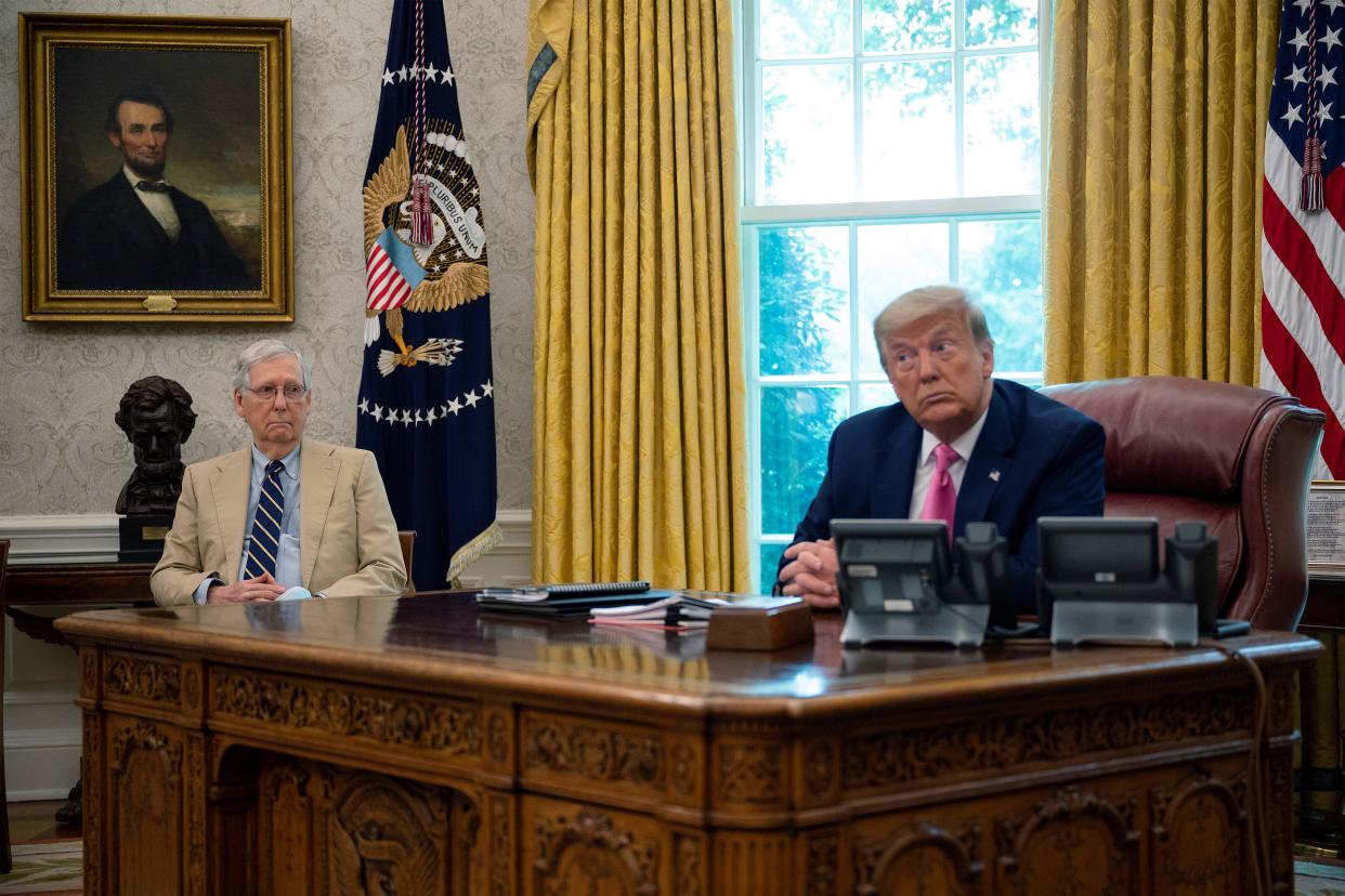 US President Donald Trump speaks with Senate Majority Leader Mitch McConnell (L), R-KY, in the Oval Office at the White House in Washington, DC, on July 20, 2020, meeting to discuss children, jobs and vaccines. (Photo by JIM WATSON / AFP) (Photo by JIM WATSON/AFP via Getty Images)