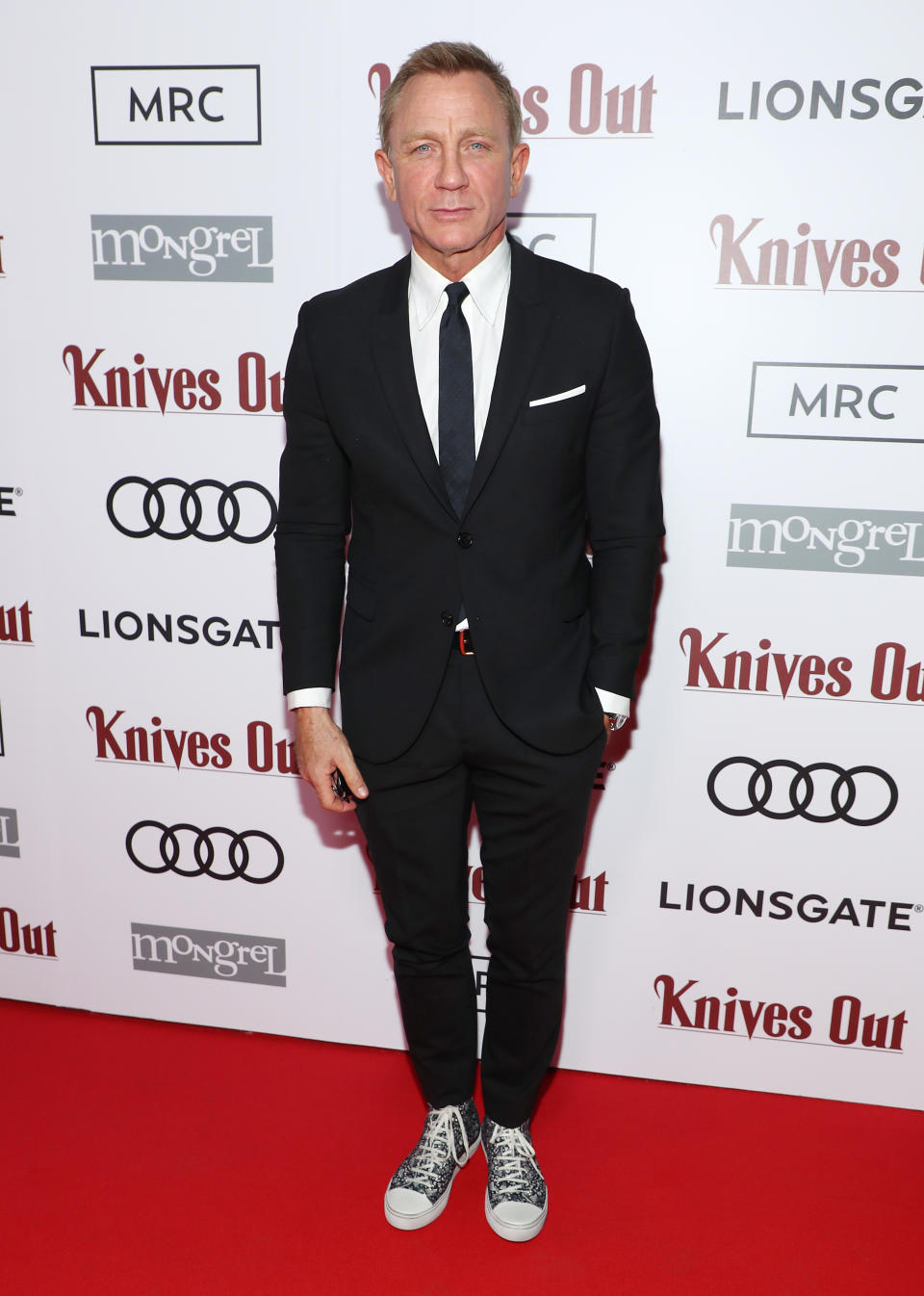 Daniel Craig wore a black two-piece suit which he styled with a pair of £510 Saint Laurent trainers at the 2019 Toronto International Film Festival [Photo: Getty Images]