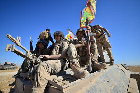 Shi'ite Popular Mobilization Forces (PMF) with Iraqi army gather on the outskirts of Tal Afar. REUTERS/Stringer