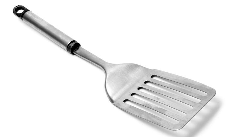 Aluminum spatula on white background