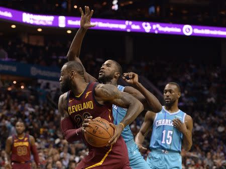 Nov 15, 2017; Charlotte, NC, USA; Cleveland Cavaliers forward LeBron James (23) drives into the paint as he is defended by Charlotte Hornets forward Michael Kidd-Gilchrist (14) during the first half at the Spectrum Center. Sam Sharpe-USA TODAY Sports