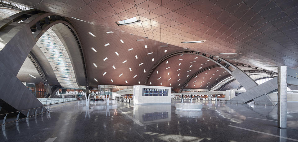 This undated handout image released by the New Hamad International Airport (HIA) which opened on Wednesday, April 30, 2014, shows the inside of the empty terminal. The massive new airport in the Qatari capital has started handling its first commercial flights after years of delays as the natural-gas rich Gulf nation works to transform itself into a major aviation hub. (AP Photo/HIA)