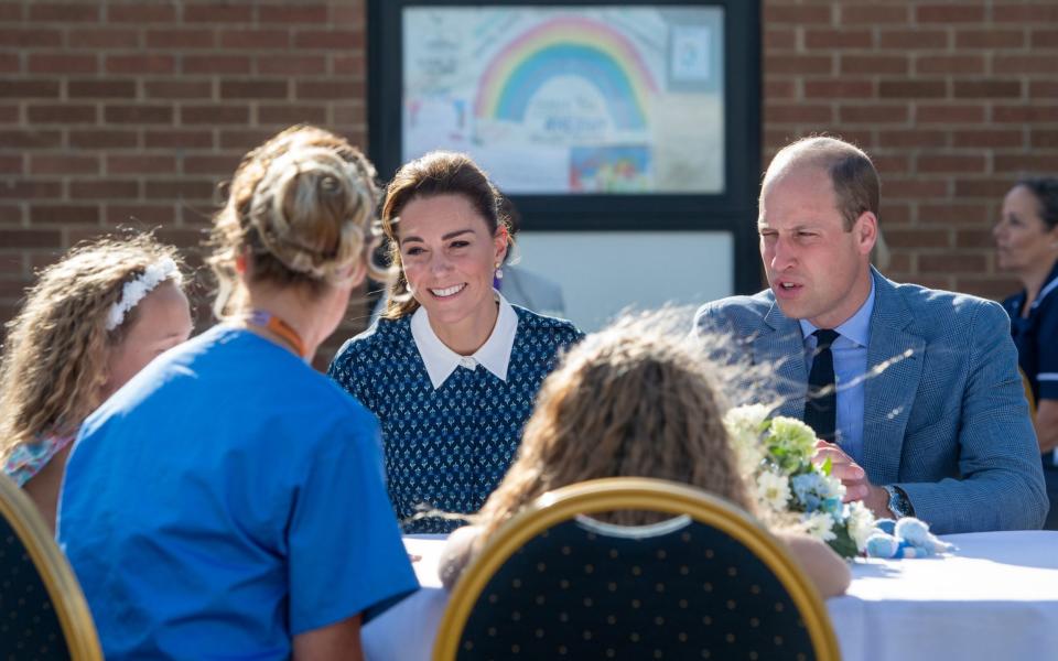 The Duke and Duchess of Cambridge meeting nurse Suzie Vaughan and daughters Hettie and Bella - PA 