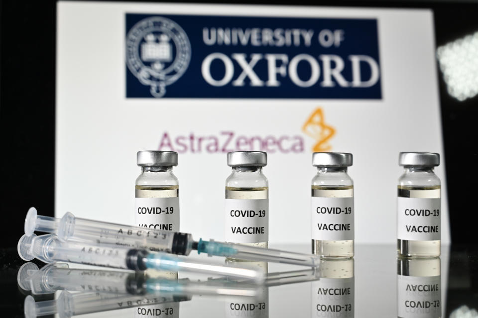 An illustration picture shows vials with Covid-19 Vaccine stickers attached and syringes, with the logo of the University of Oxford and its partner British pharmaceutical company AstraZeneca, on November 17, 2020. (Photo by JUSTIN TALLIS / AFP) (Photo by JUSTIN TALLIS/AFP via Getty Images)