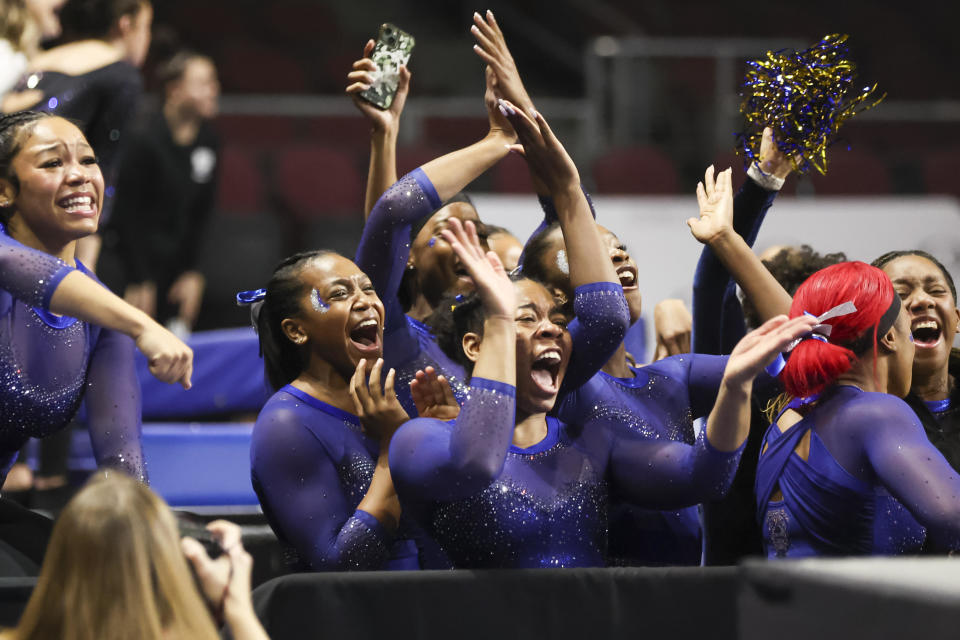 Members of the Fisk University team cheer during a Super 16 gymnastics meet on Jan. 6, in Las Vegas. The Fisk women's gymnastics team became the first historically Black college or university to compete at the NCAA level. / Credit: Chase Stevens / AP