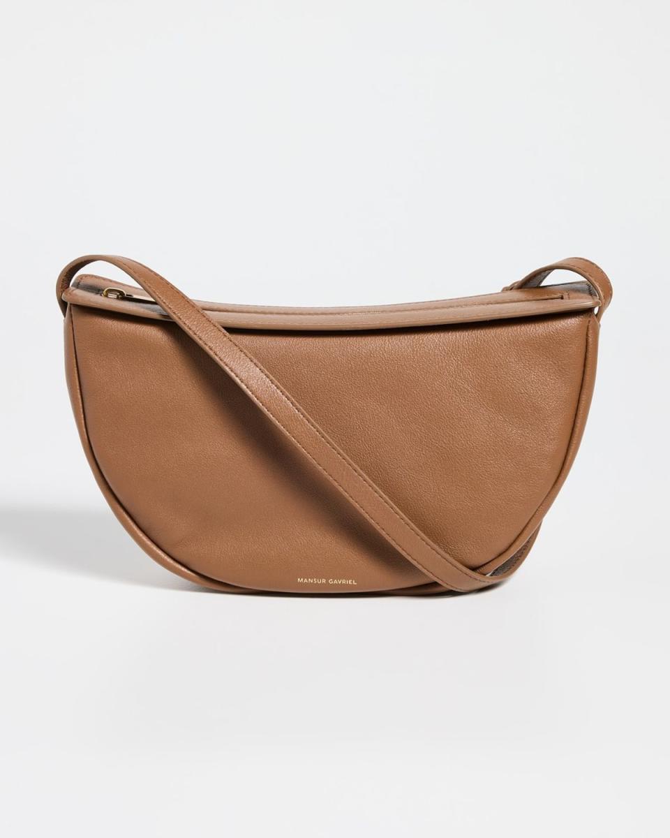 <p><a href="https://go.redirectingat.com?id=74968X1596630&url=https%3A%2F%2Fwww.shopbop.com%2Fmoon-sling-bag-mansur-gavriel%2Fvp%2Fv%3D1%2F1573901799.htm&sref=https%3A%2F%2Fwww.elle.com%2Ffashion%2Fshopping%2Fg45701466%2Fbest-crossbody-bags-for-travel%2F" rel="nofollow noopener" target="_blank" data-ylk="slk:Shop Now;elm:context_link;itc:0;sec:content-canvas" class="link ">Shop Now</a></p><p>Moon Sling Bag</p><p>Shopbop</p><p>$495.00</p>