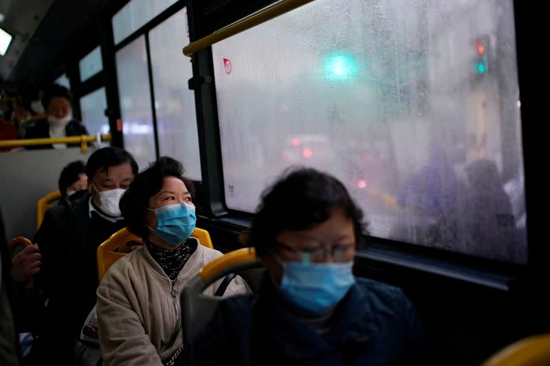 People wearing face masks are seen on a bus amid the global outbreak of the coronavirus disease (COVID-19) in Shanghai